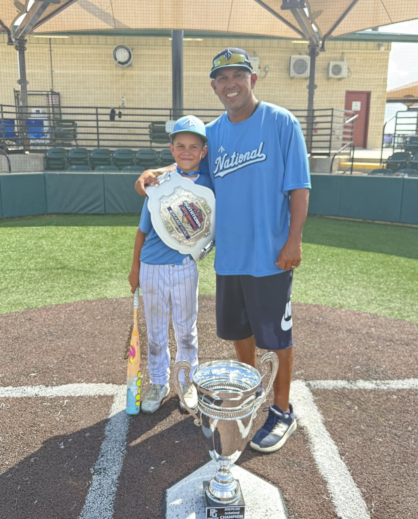 Coach PJ Garcia with the PG Invitational championship trophy
